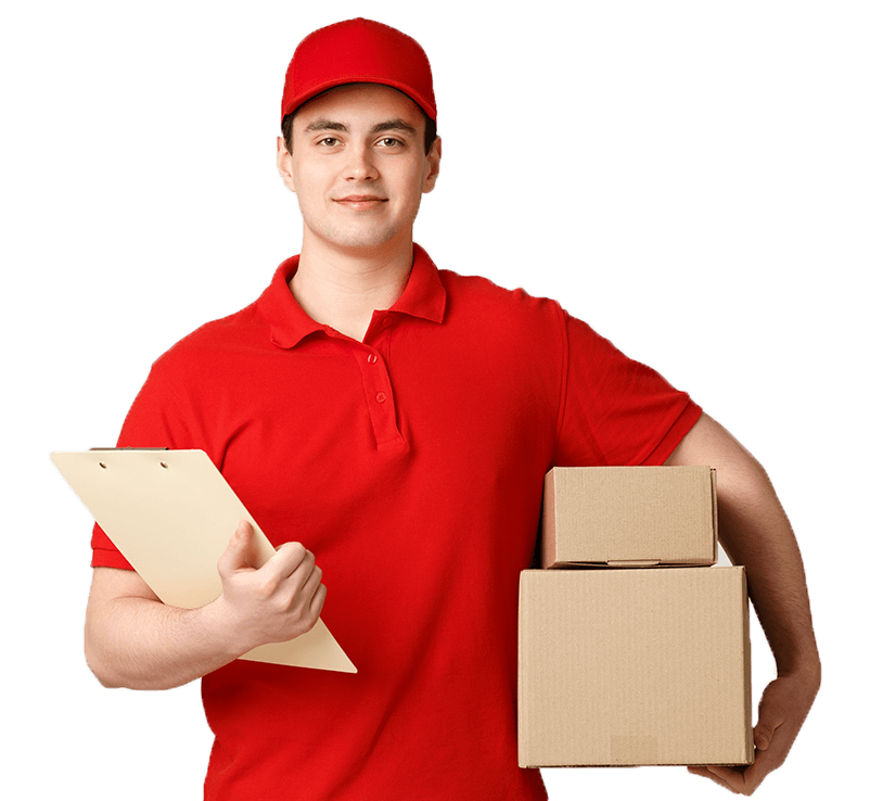 A smiling delivery man wearing a red uniform and cap, holding two cardboard boxes in one hand and a clipboard in the other, isolated on a white background.